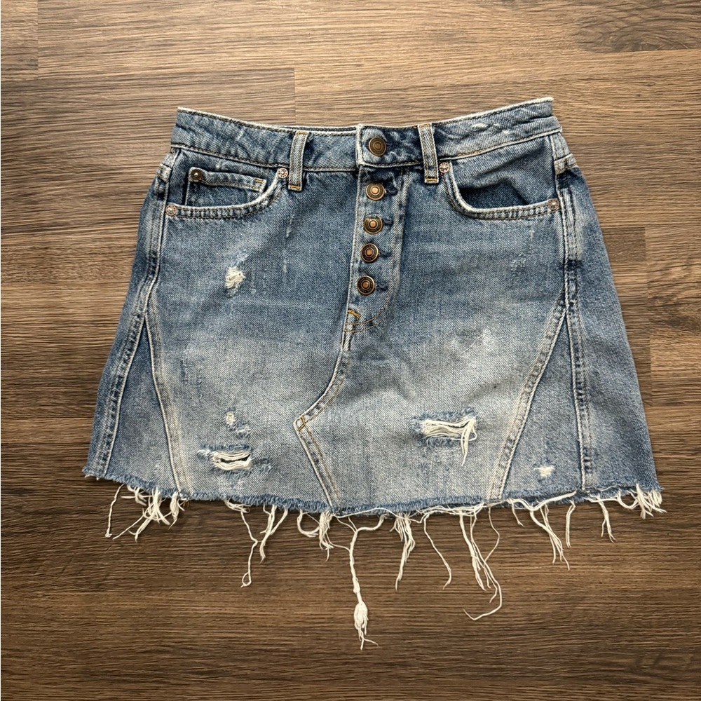Distressed denim mini skirt